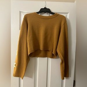 Cropped mustard yellow sweater with flowers down sleeves